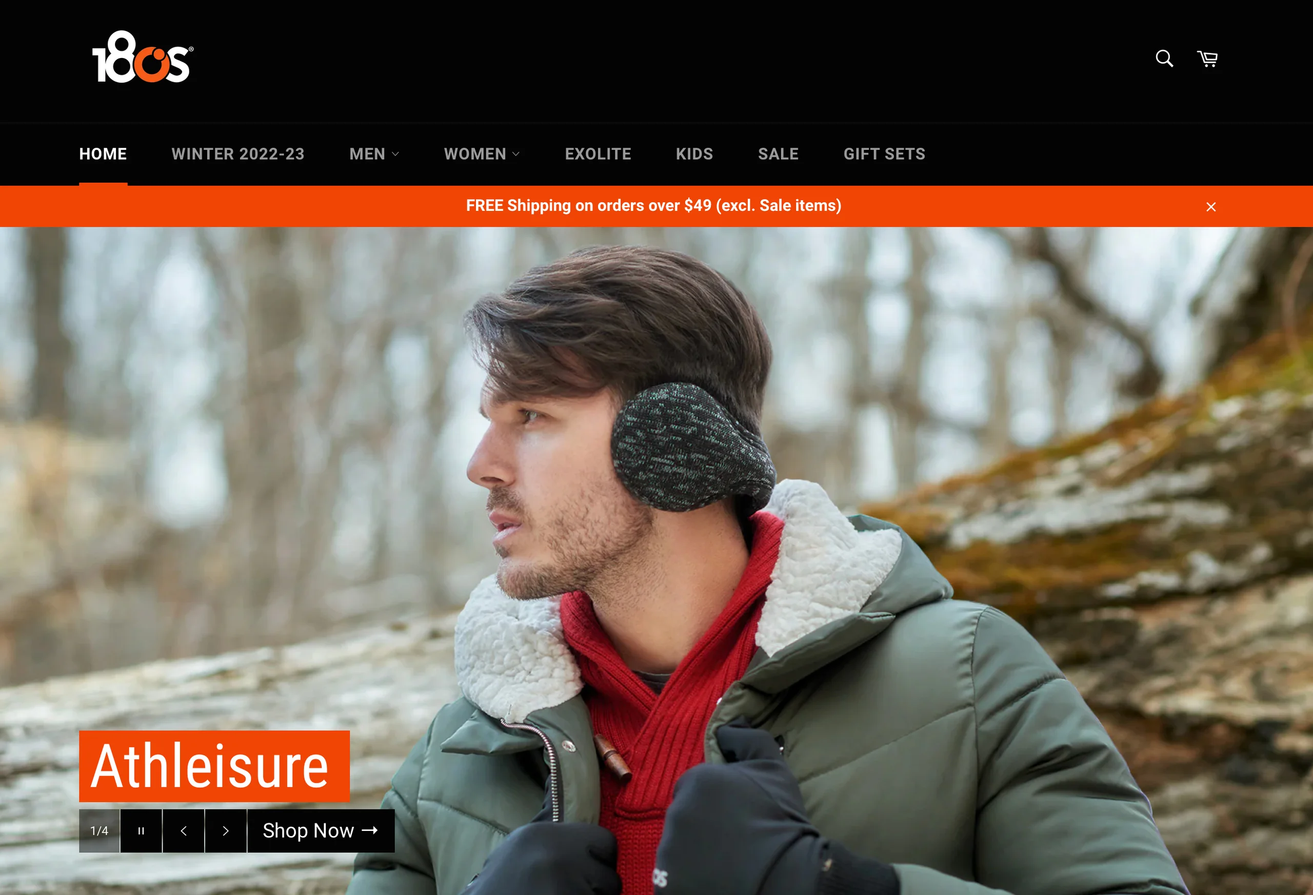 A screenshot of the 180s website featuring a model in earmuffs and a green coat beneath an Athleisure heading.