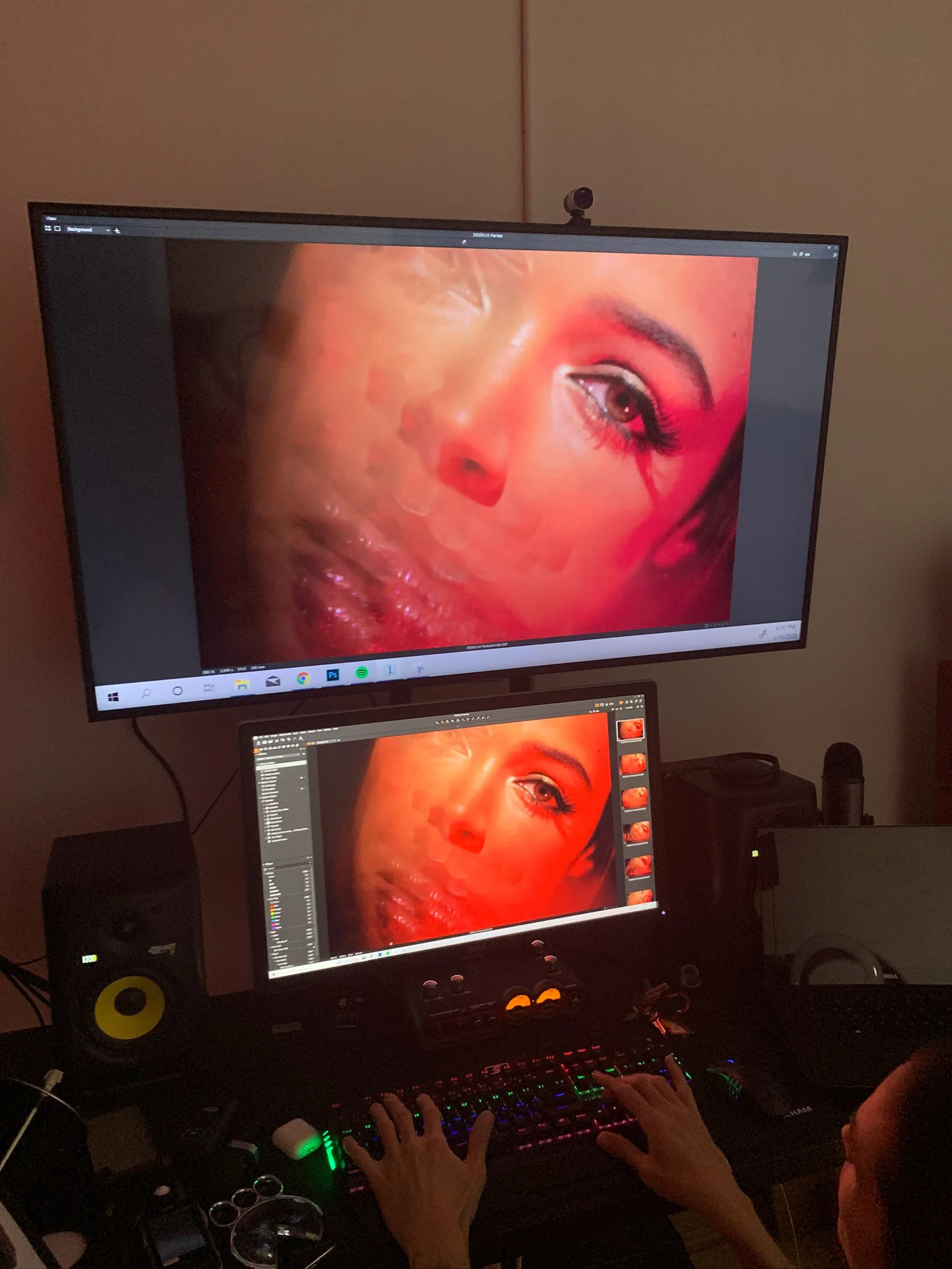A retouching workstation displaying a red-lit beauty portrait.
