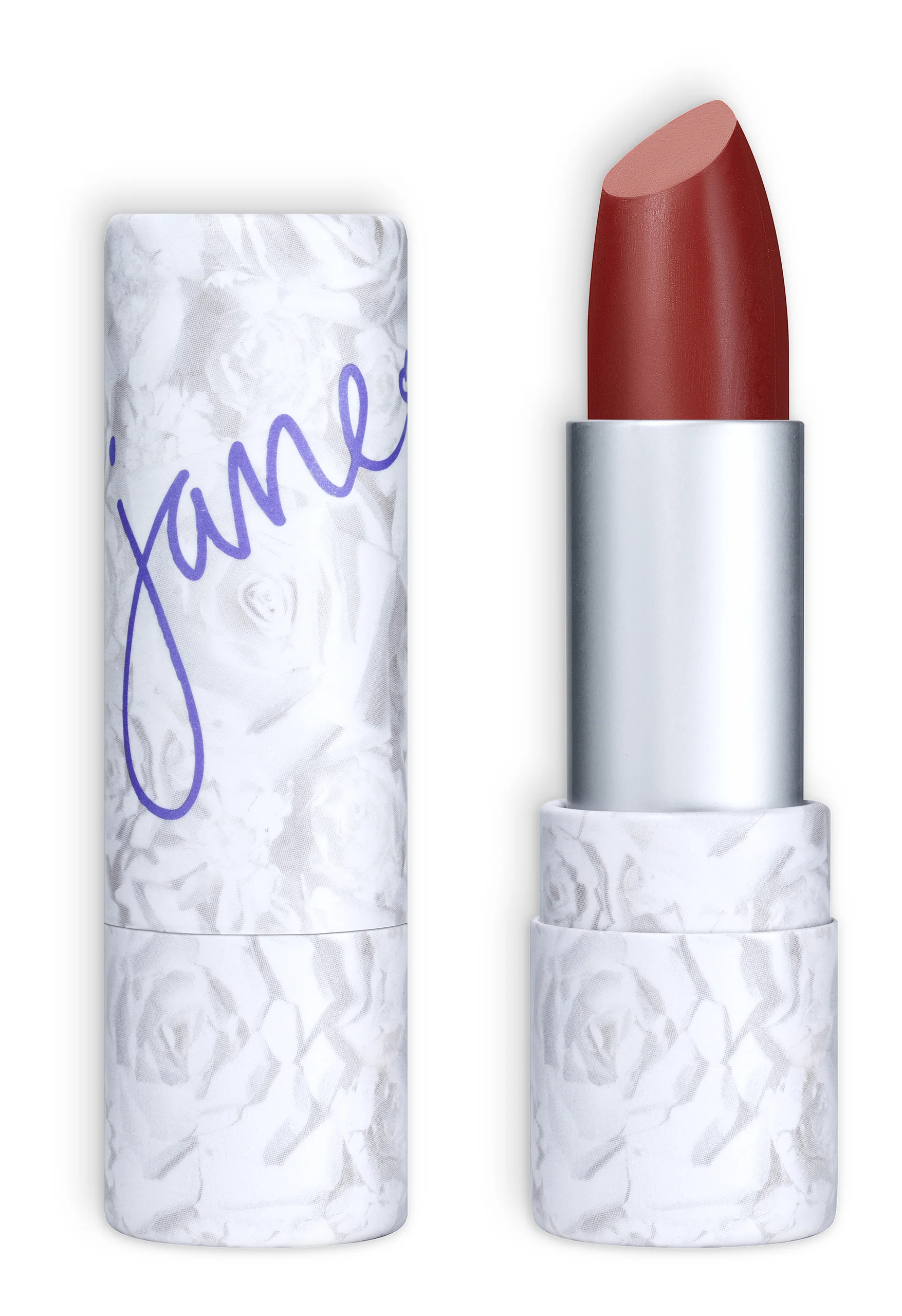 A deep red Jane lipstick beside its white floral case on black.