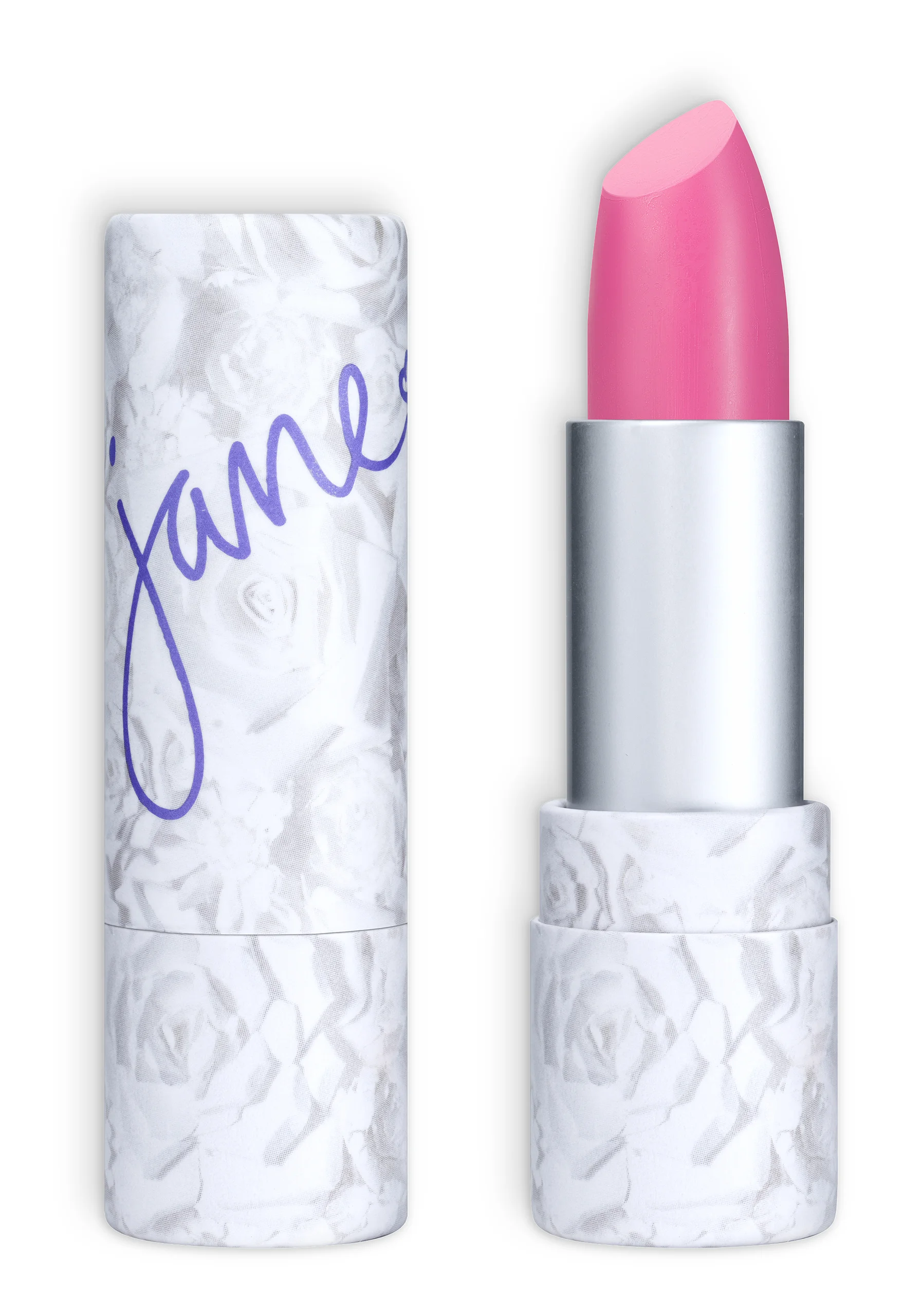A pink Jane lipstick beside its white floral case on black.