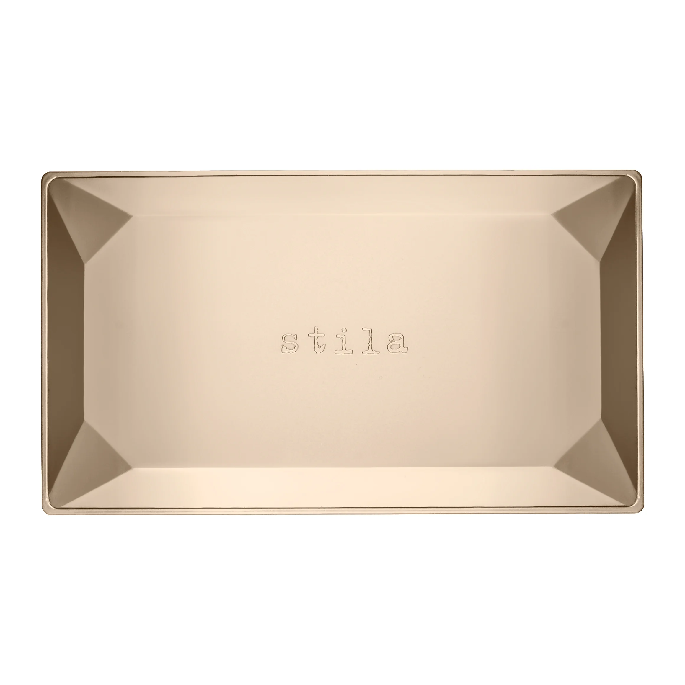 A closed gold Stila palette case against white.